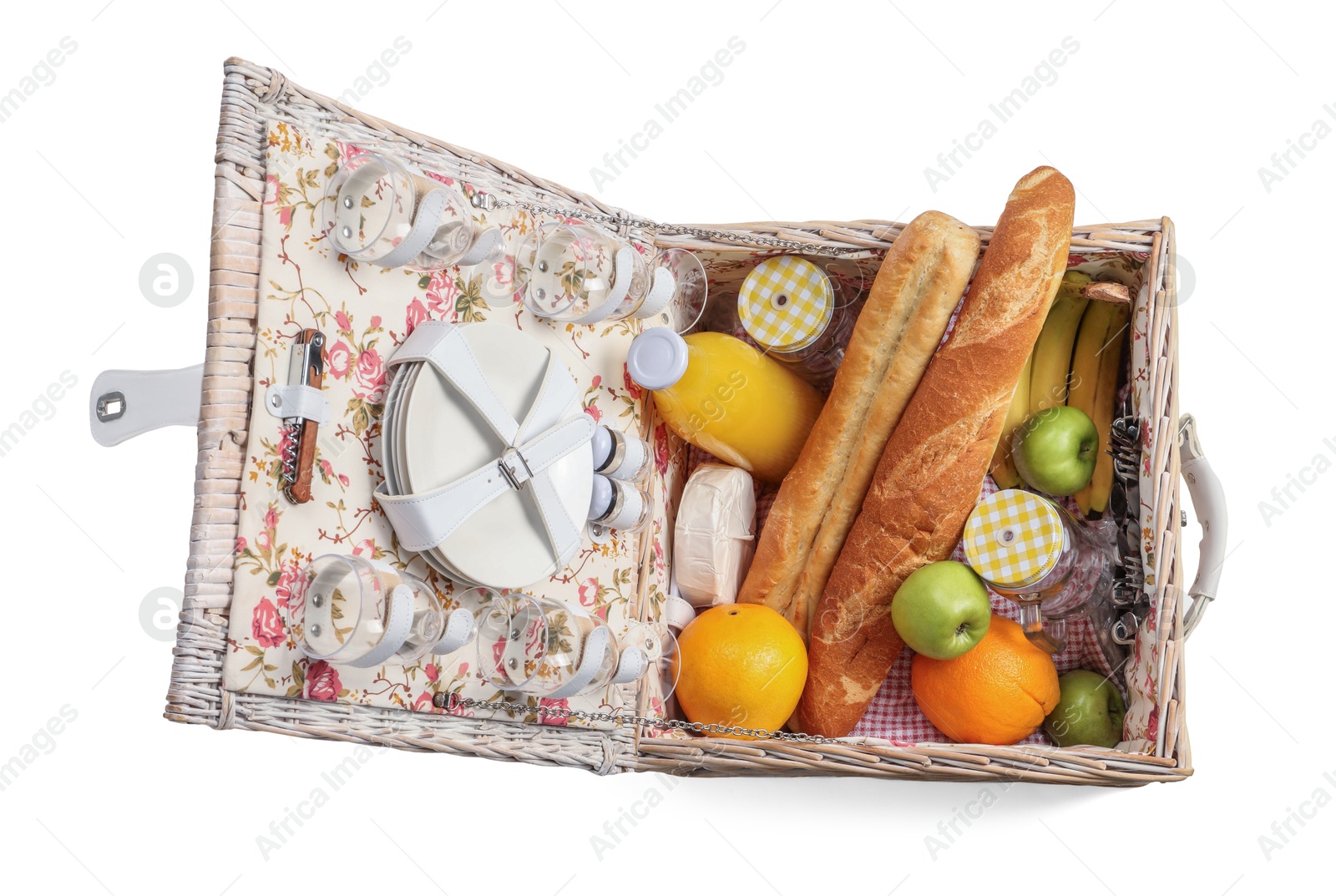 Photo of Picnic basket with tableware, food and drink isolated on white, top view