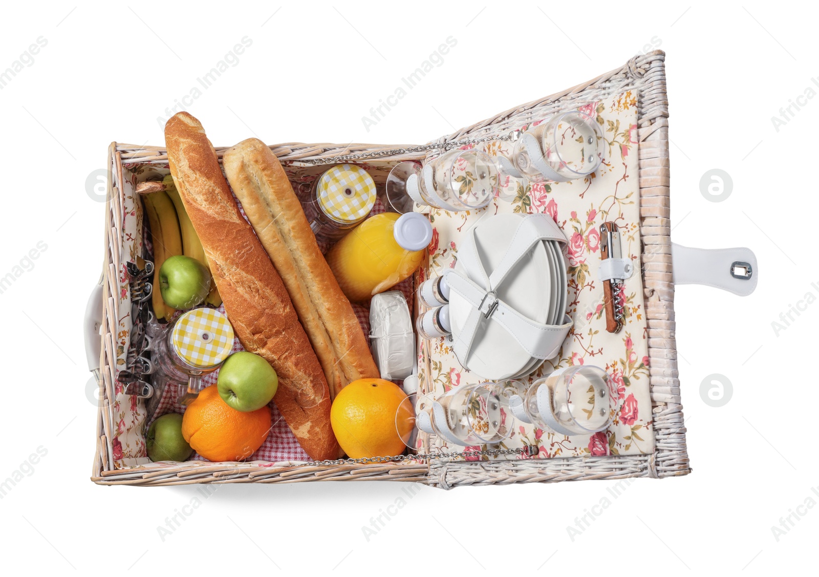 Photo of Picnic basket with tableware, food and drink isolated on white, top view