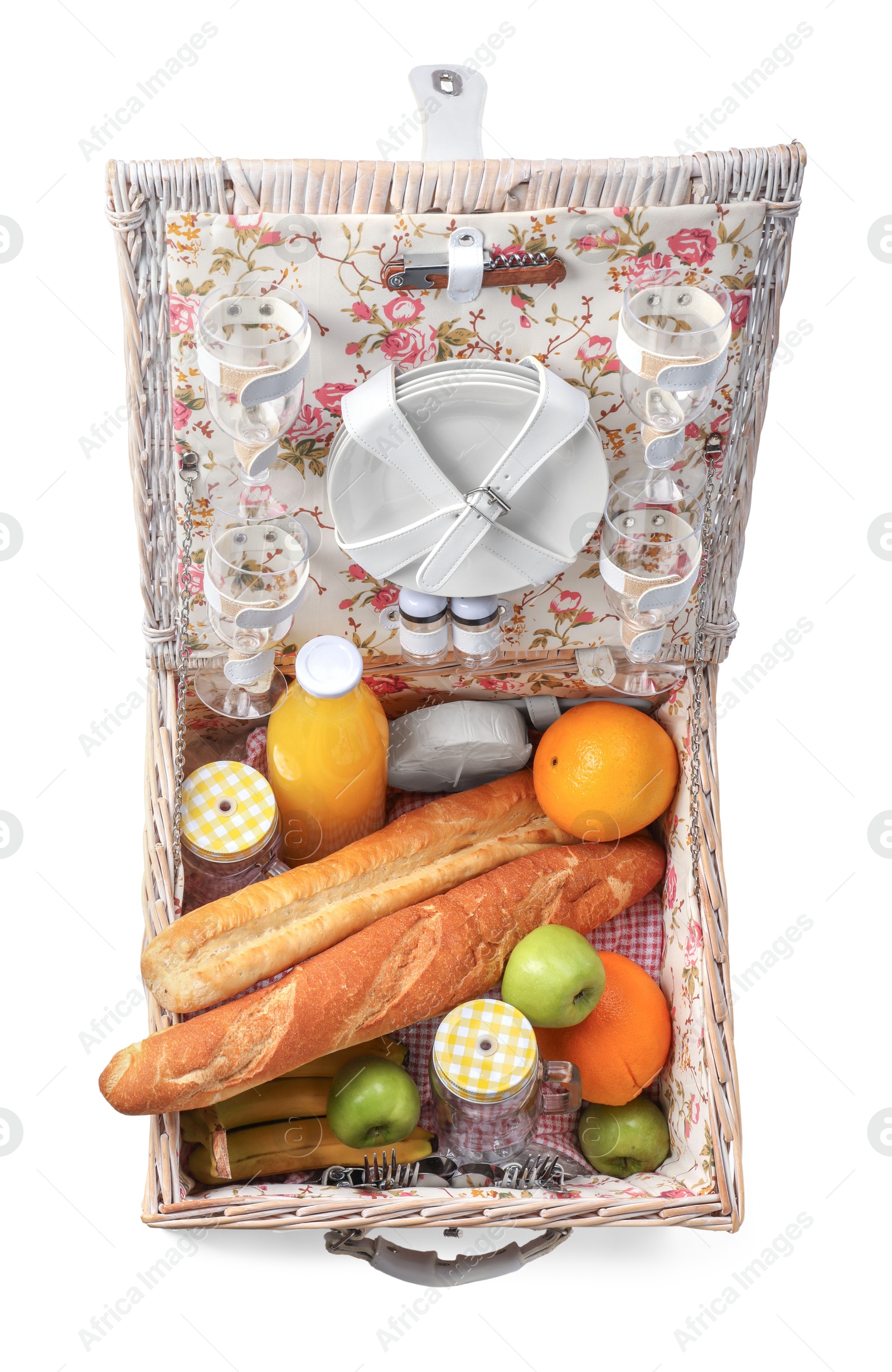 Photo of Picnic basket with tableware, food and drink isolated on white, top view