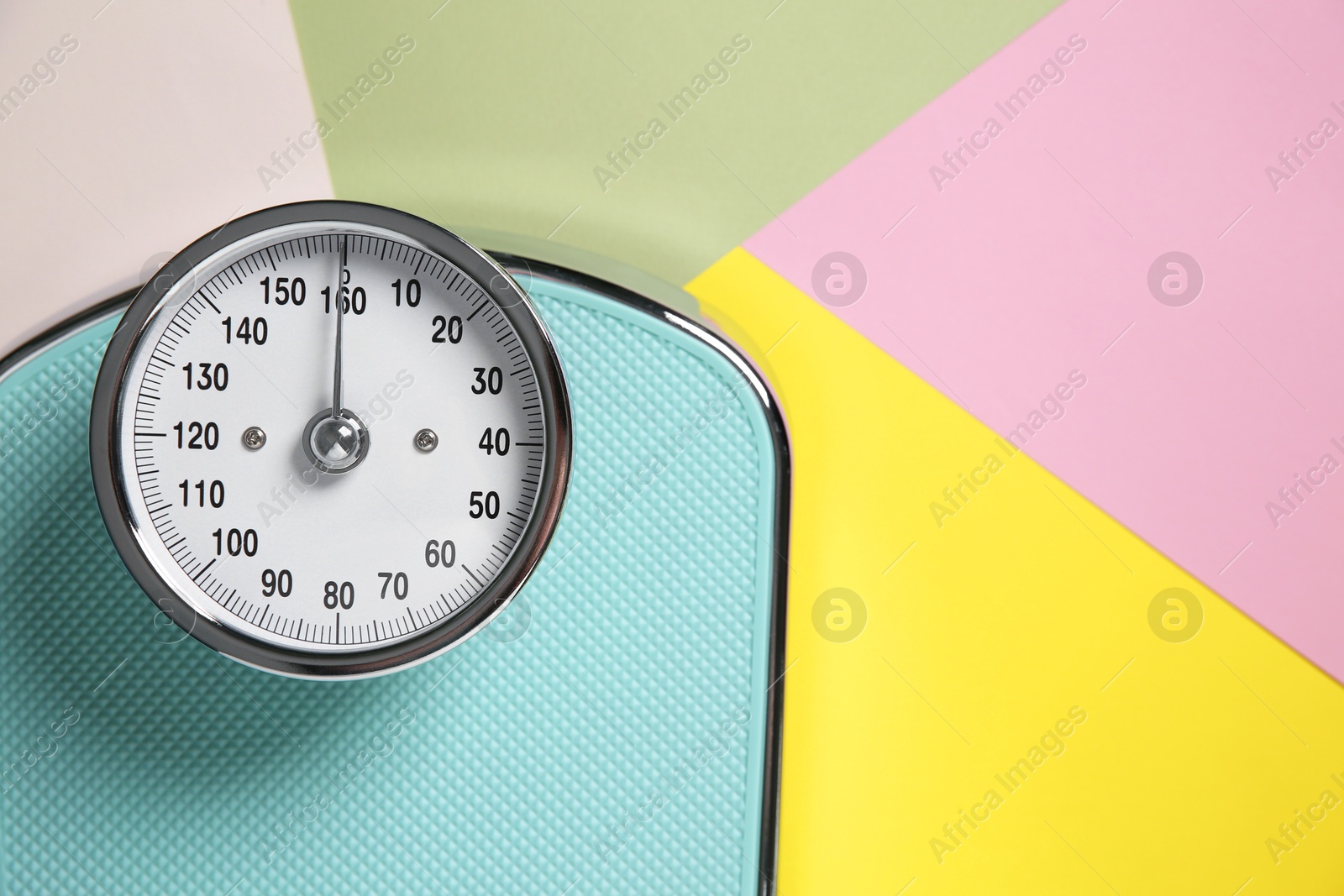 Photo of One bathroom scale on color background, top view. Space for text