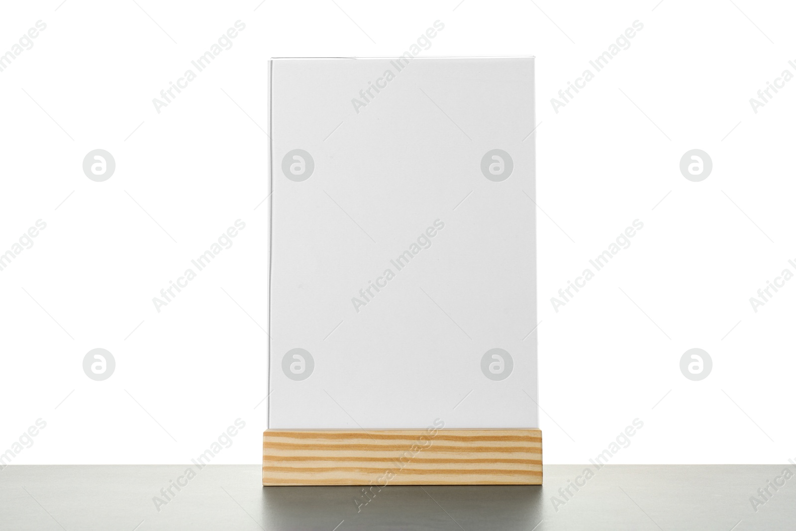 Photo of Menu holder on grey table against white background. Mockup for design