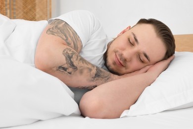 Bedtime. Handsome man sleeping in bed indoors