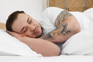 Bedtime. Handsome man sleeping in bed indoors