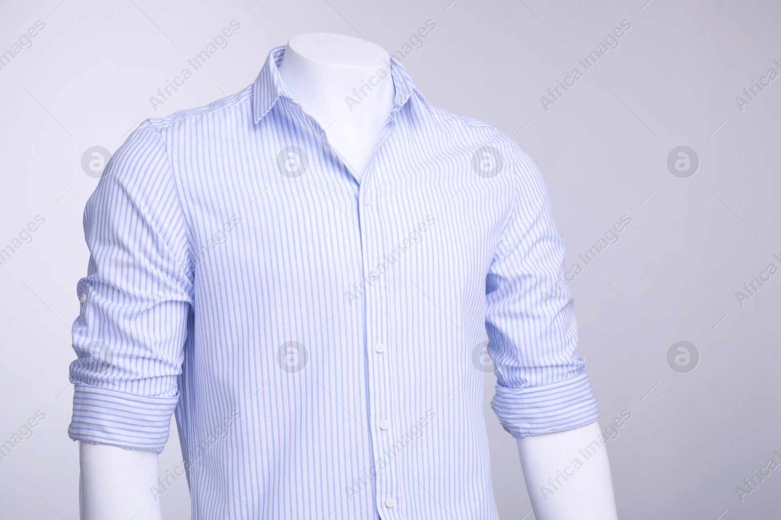 Photo of Male mannequin dressed in stylish shirt on grey background