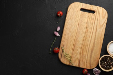 Photo of Cutting board, fresh tomatoes and different spices on grey textured table, flat lay. Space for text