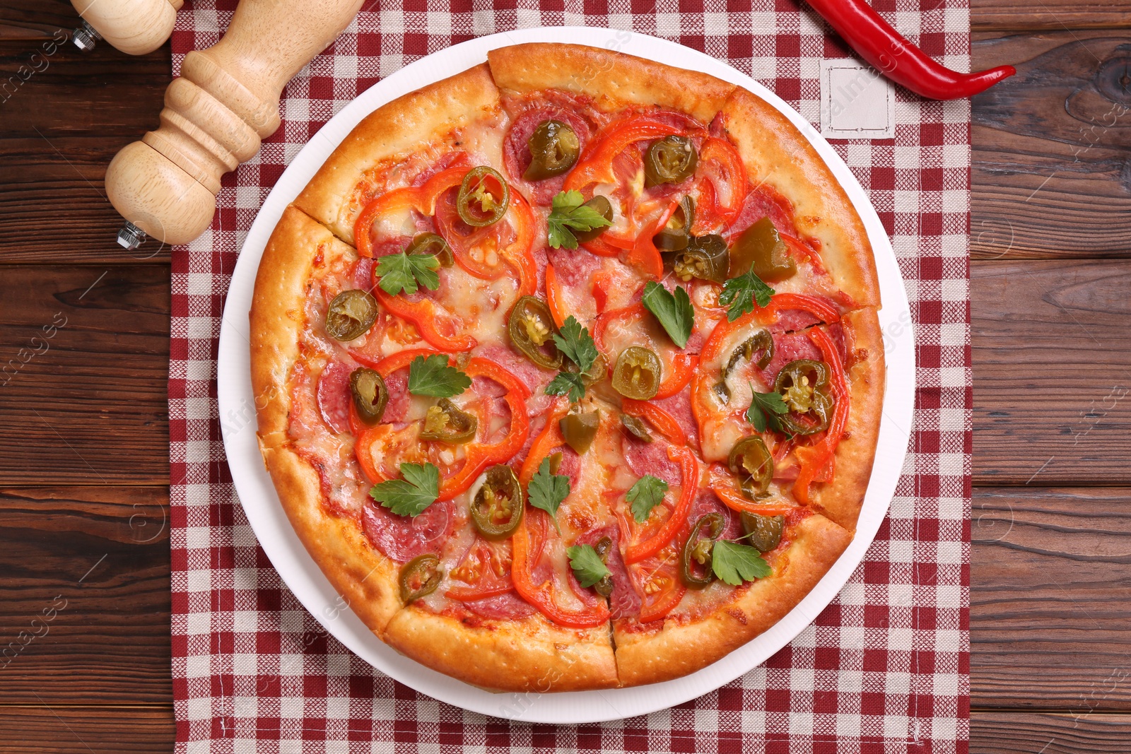 Photo of Delicious hot pizza Diablo on wooden table, top view