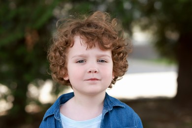 Portrait of little boy outdoors. Cute child