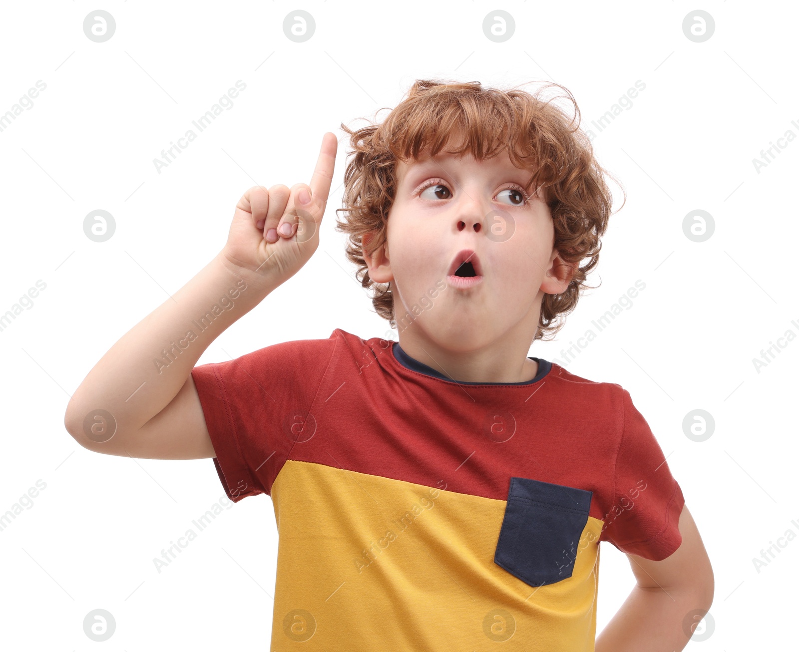 Photo of Portrait of emotional little boy pointing at something on white background