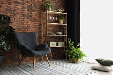 Shelving unit, green houseplants, armchair, pillows and elegant curtain in room. Interior design