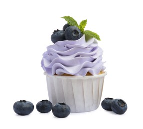 Photo of Tasty cupcake with blueberries and mint isolated on white