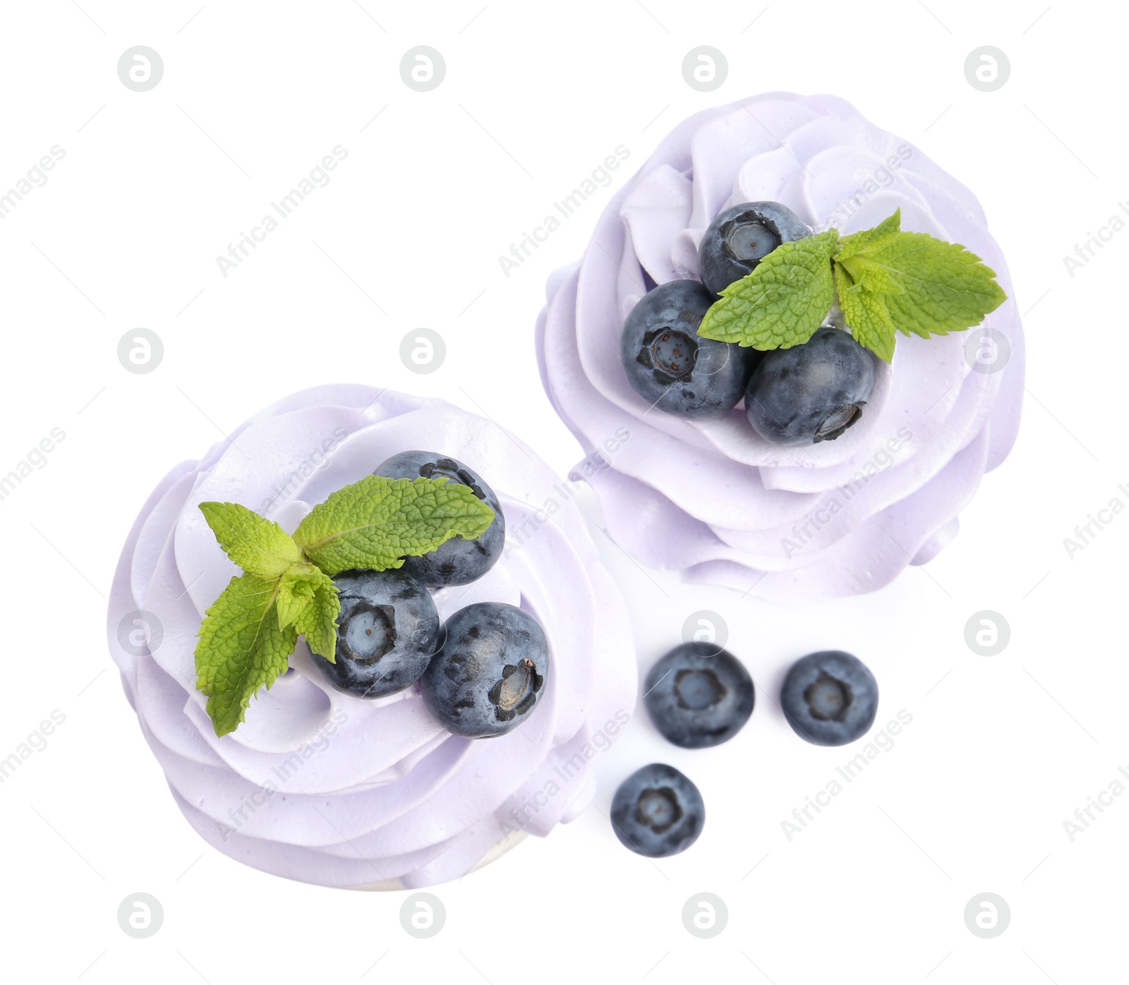 Photo of Tasty cupcakes with blueberries and mint isolated on white, top view