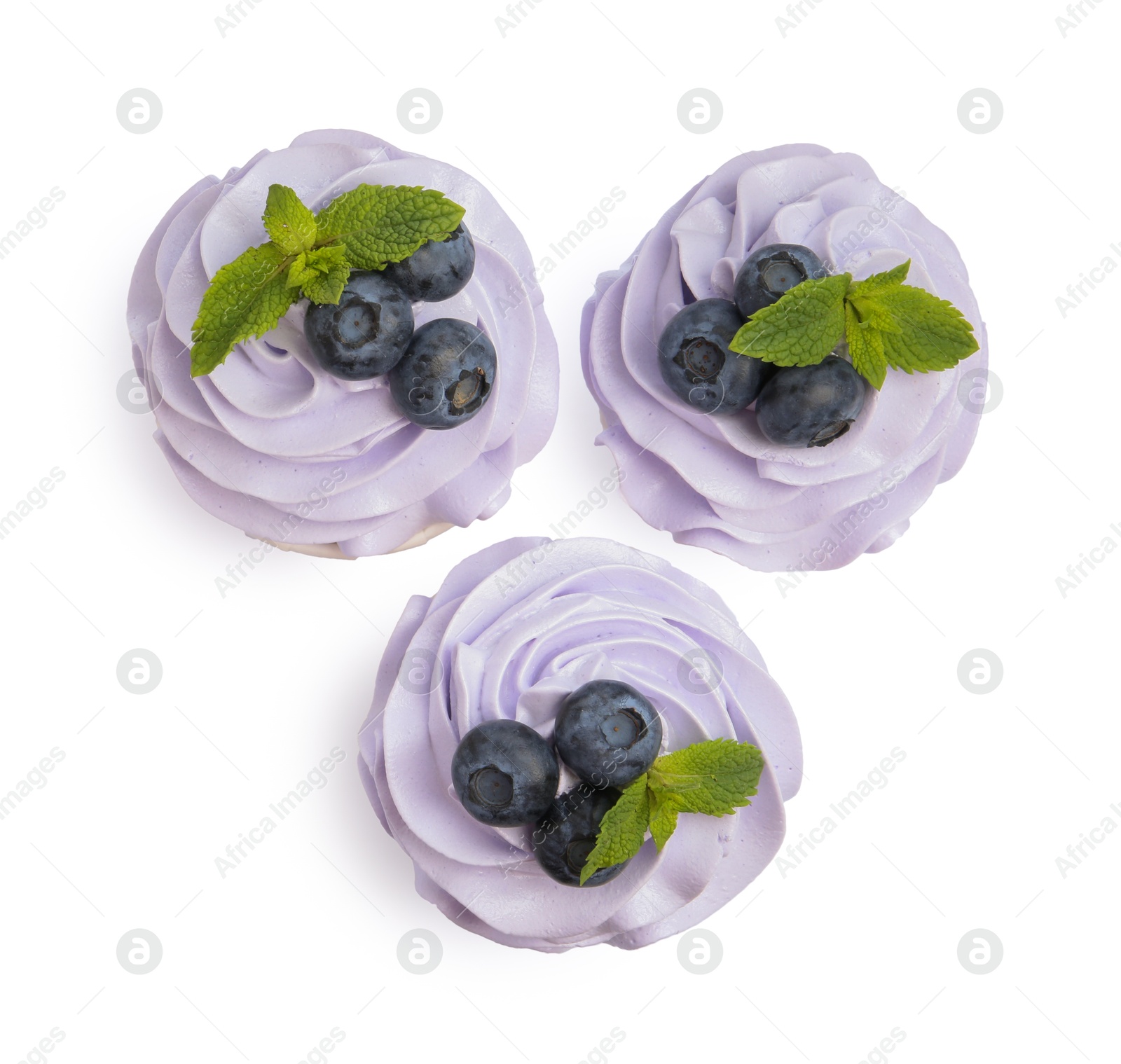 Photo of Tasty cupcakes with blueberries and mint isolated on white, top view