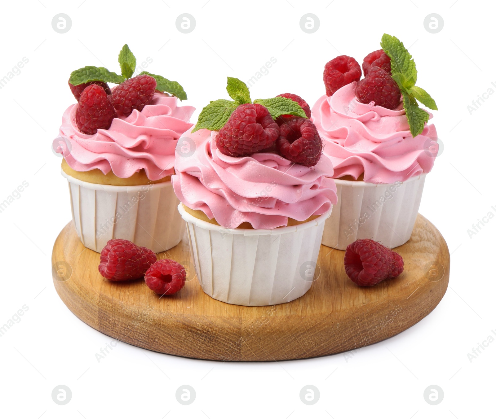 Photo of Tasty cupcakes with raspberries and mint isolated on white