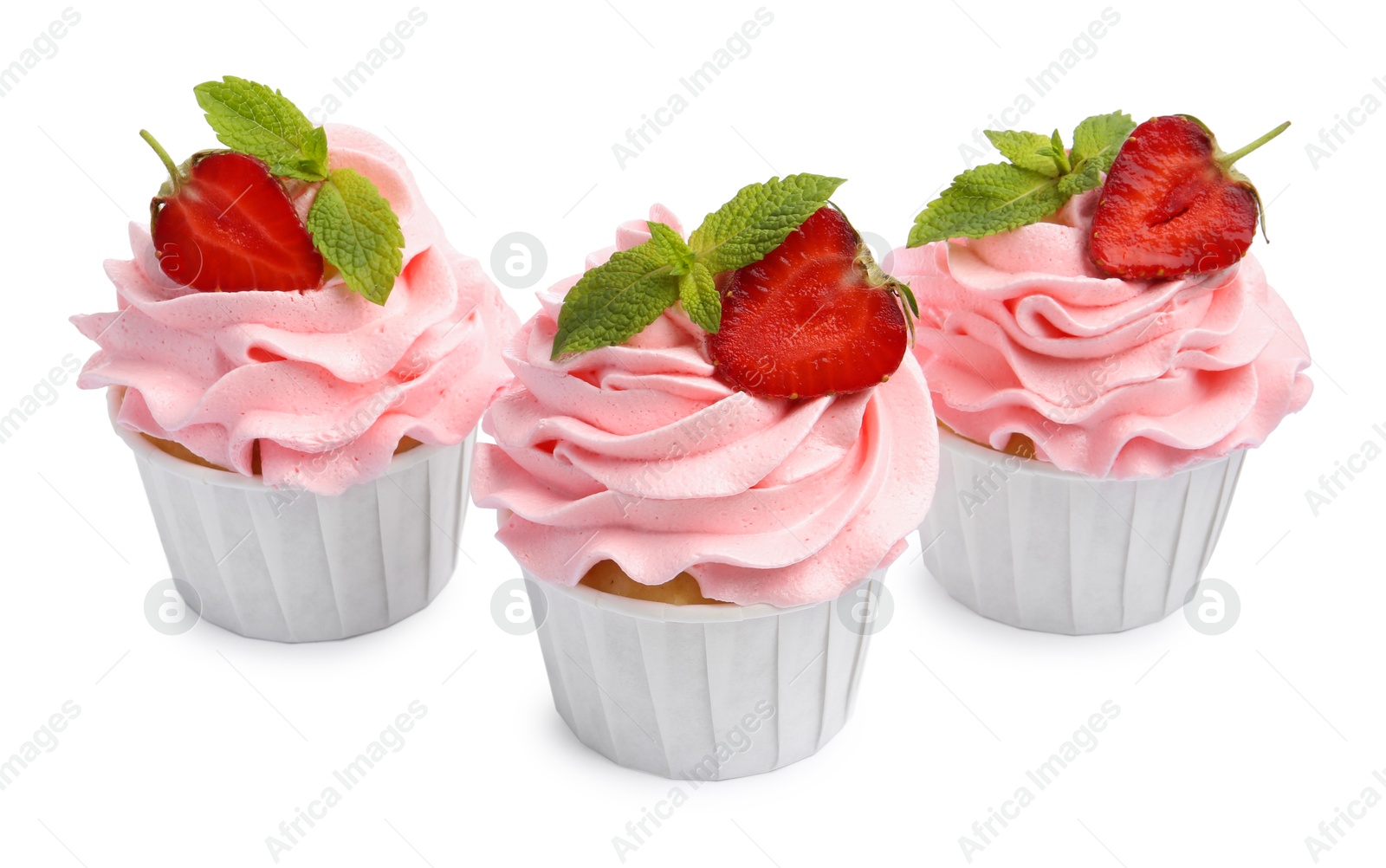 Photo of Tasty cupcakes with strawberries and mint isolated on white