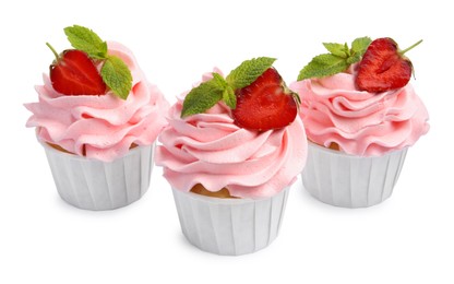 Photo of Tasty cupcakes with strawberries and mint isolated on white