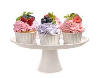 Photo of Tasty cupcakes with different berries isolated on white