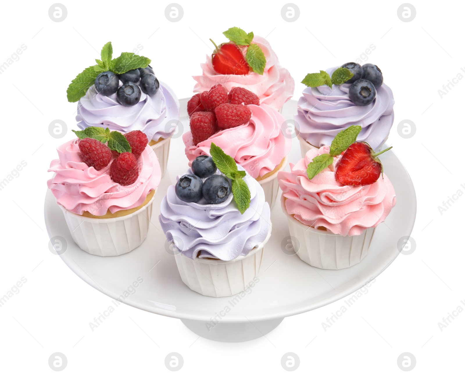 Photo of Tasty cupcakes with different berries isolated on white