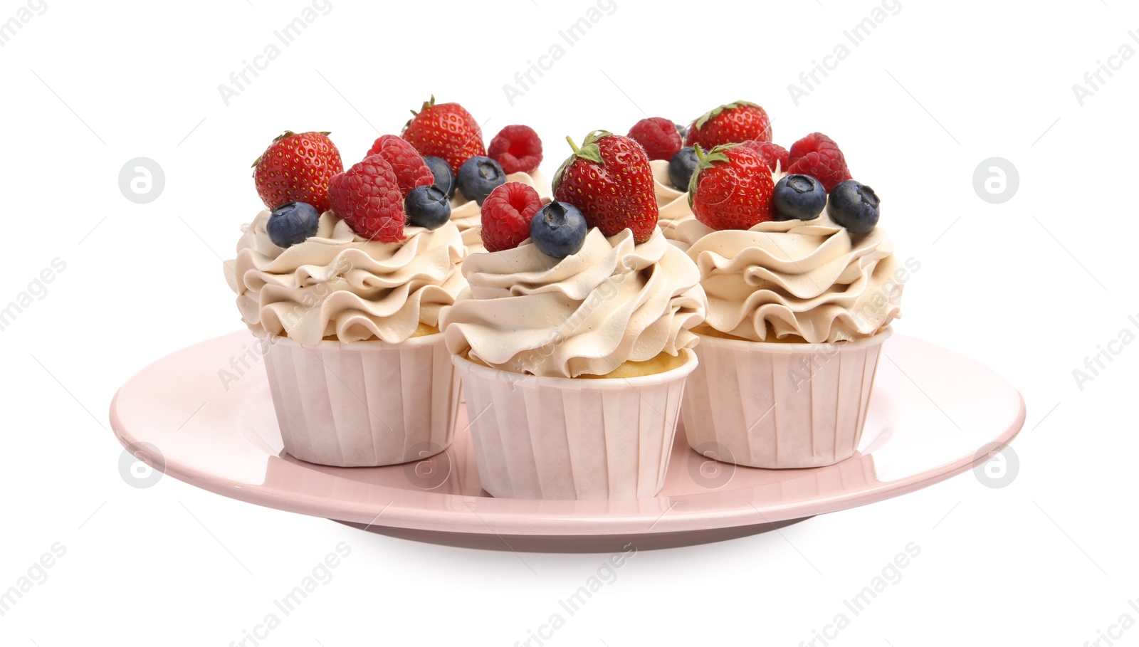 Photo of Tasty cupcakes with different berries isolated on white