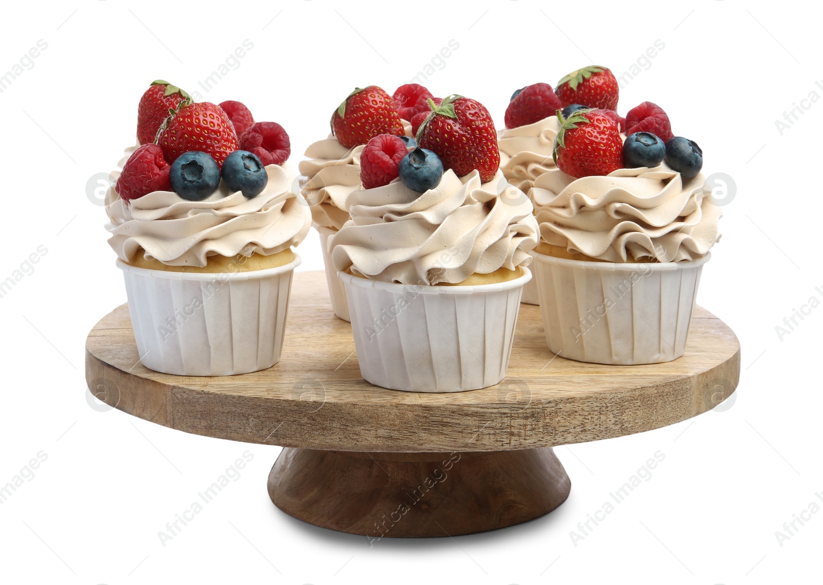 Photo of Tasty cupcakes with different berries isolated on white