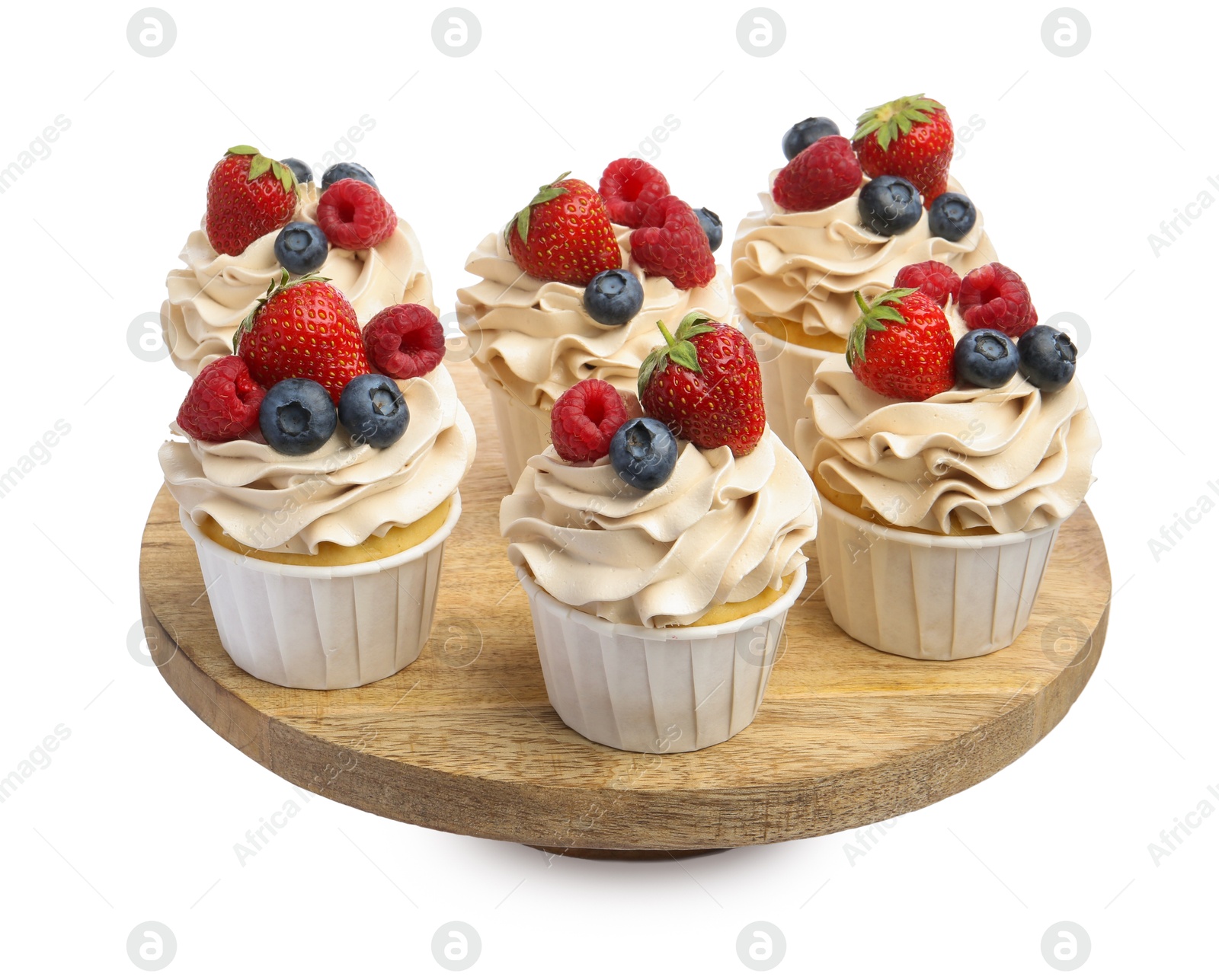 Photo of Tasty cupcakes with different berries isolated on white