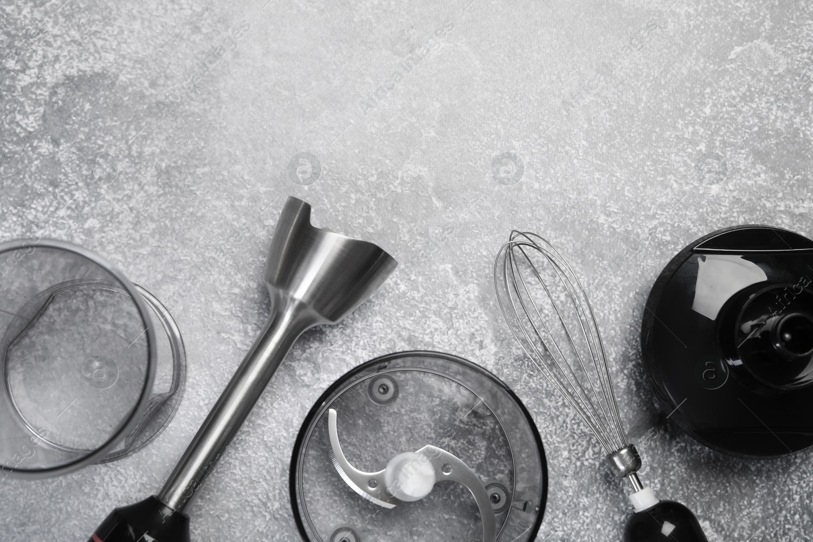 Photo of Hand blender kit on grey table, flat lay