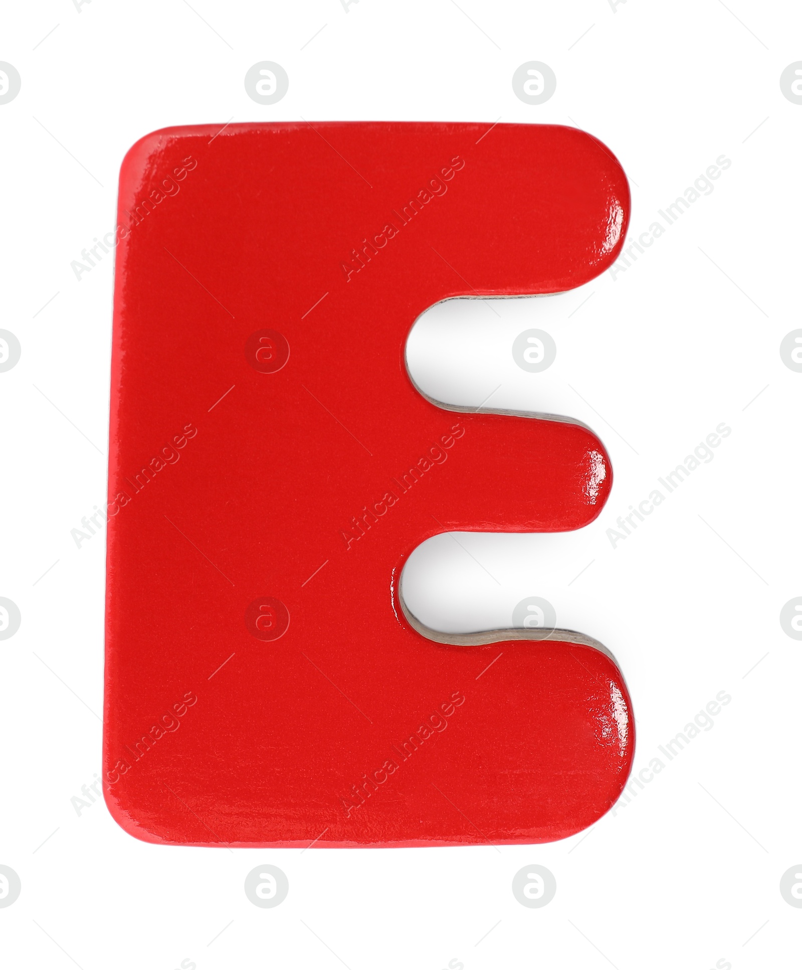 Photo of Red magnetic letter E isolated on white, top view. Alphabet