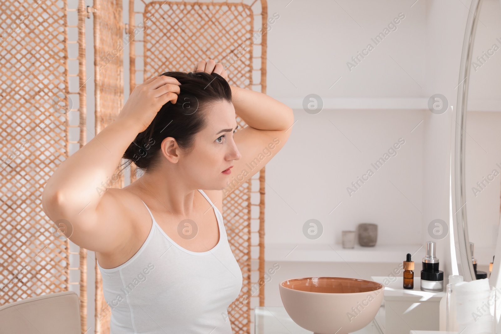 Photo of Woman with hair loss problem at home