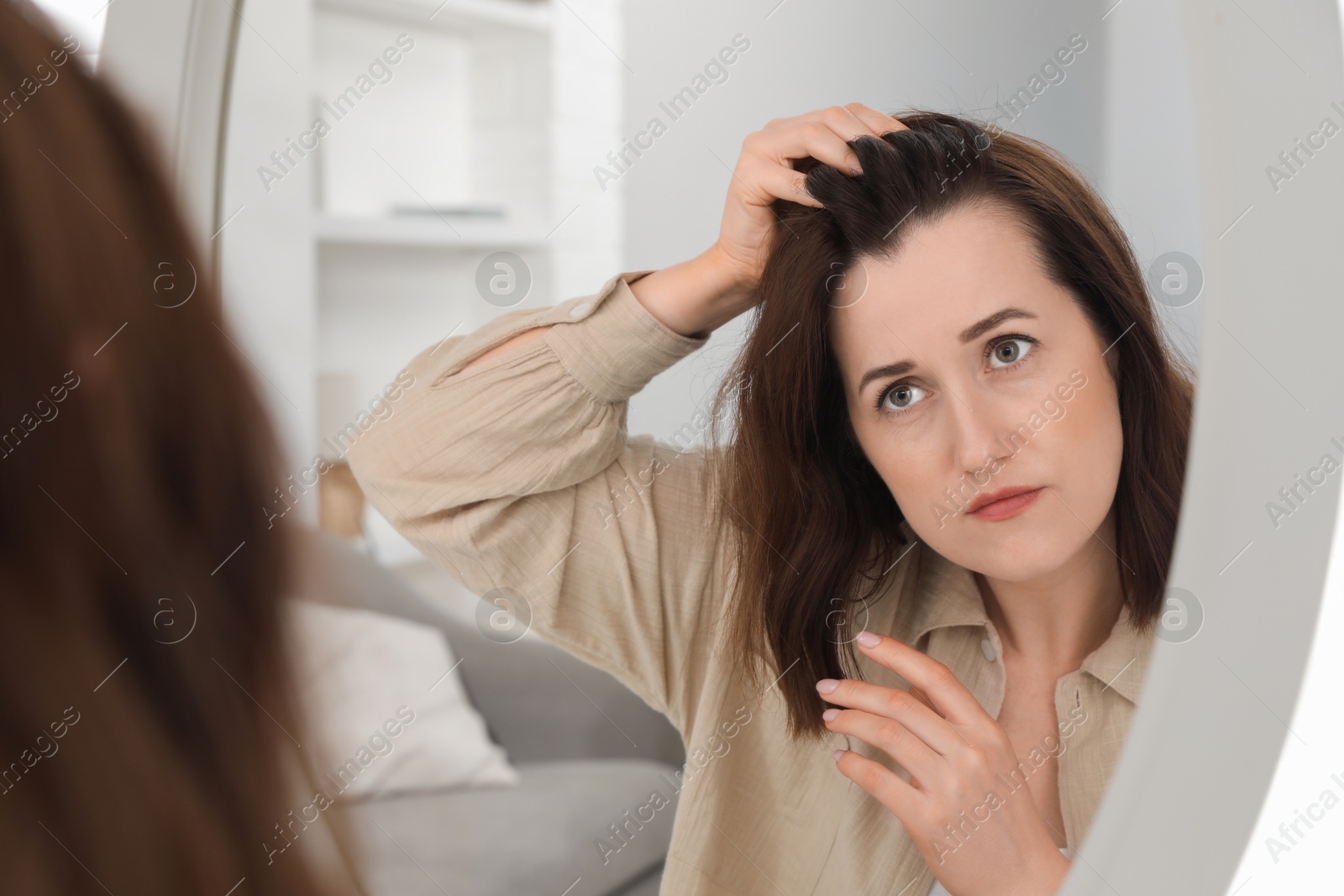 Photo of Woman with hair loss problem at home