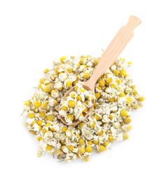 Photo of Pile of chamomile flowers and wooden spoon isolated on white, top view