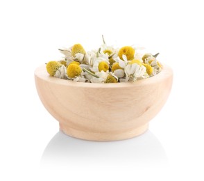 Chamomile flowers in wooden bowl isolated on white