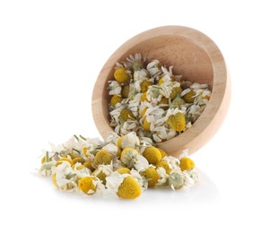 Photo of Chamomile flowers and wooden bowl isolated on white