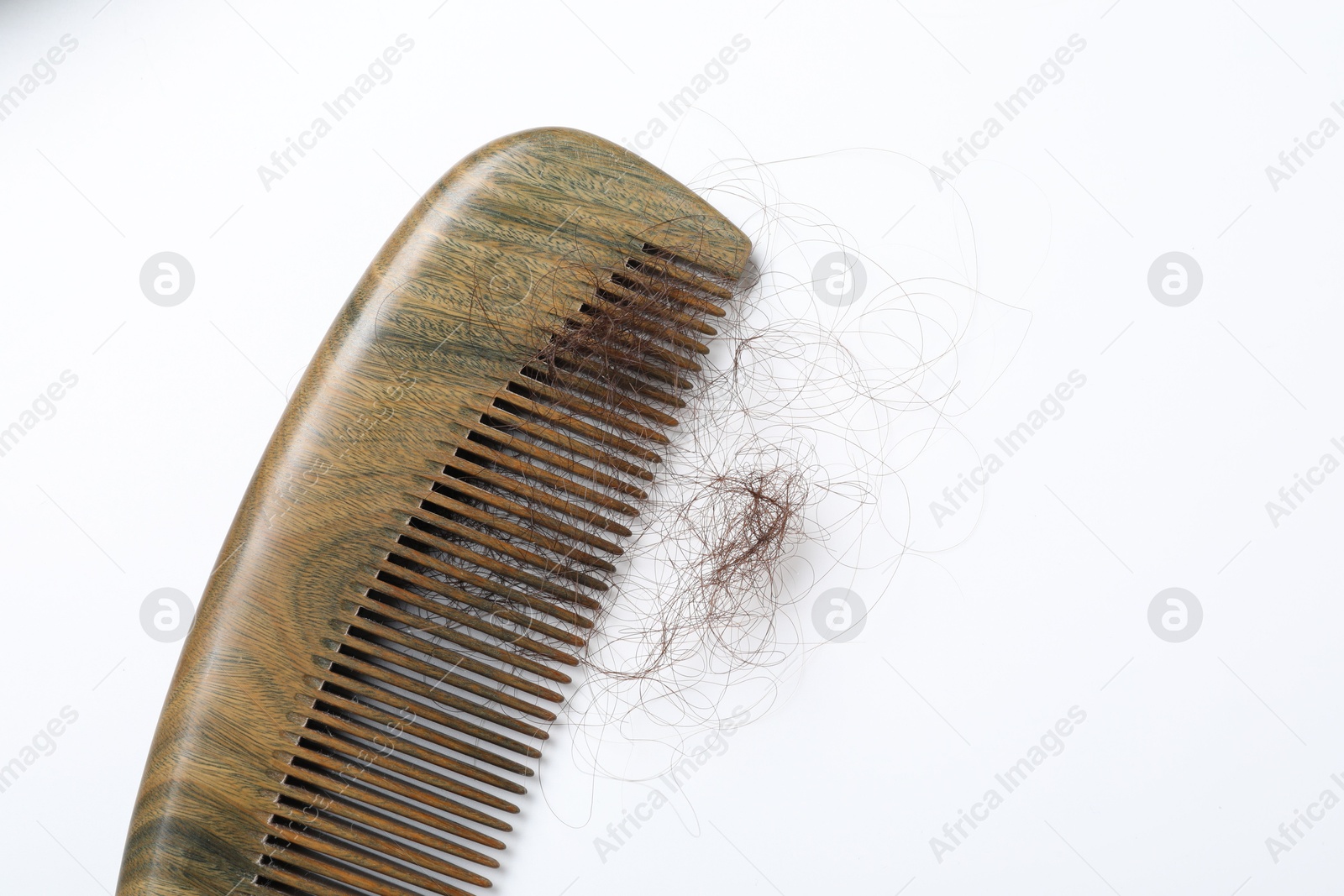 Photo of One comb with lost hair isolated on white, top view