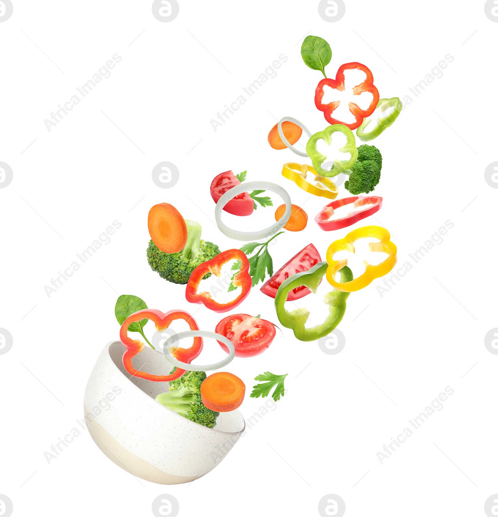 Image of Bowl with fresh vegetables in air on white background. Making fresh salad