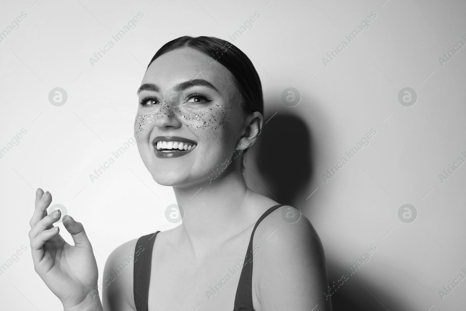 Image of Fashionable portrait of beautiful woman on light grey background, black and white effect