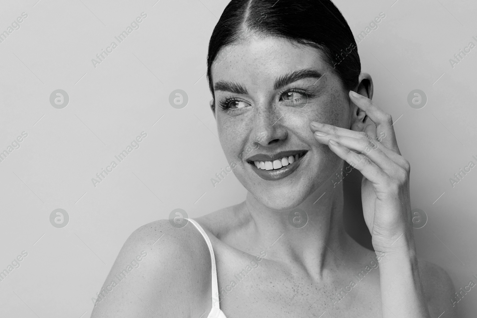 Image of Fashionable portrait of beautiful woman on light grey background, black and white effect