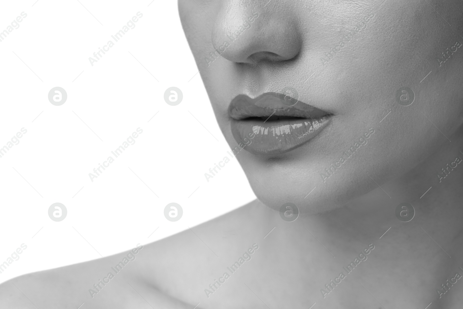 Image of Woman with beautiful lips on white background, closeup. Black and white effect