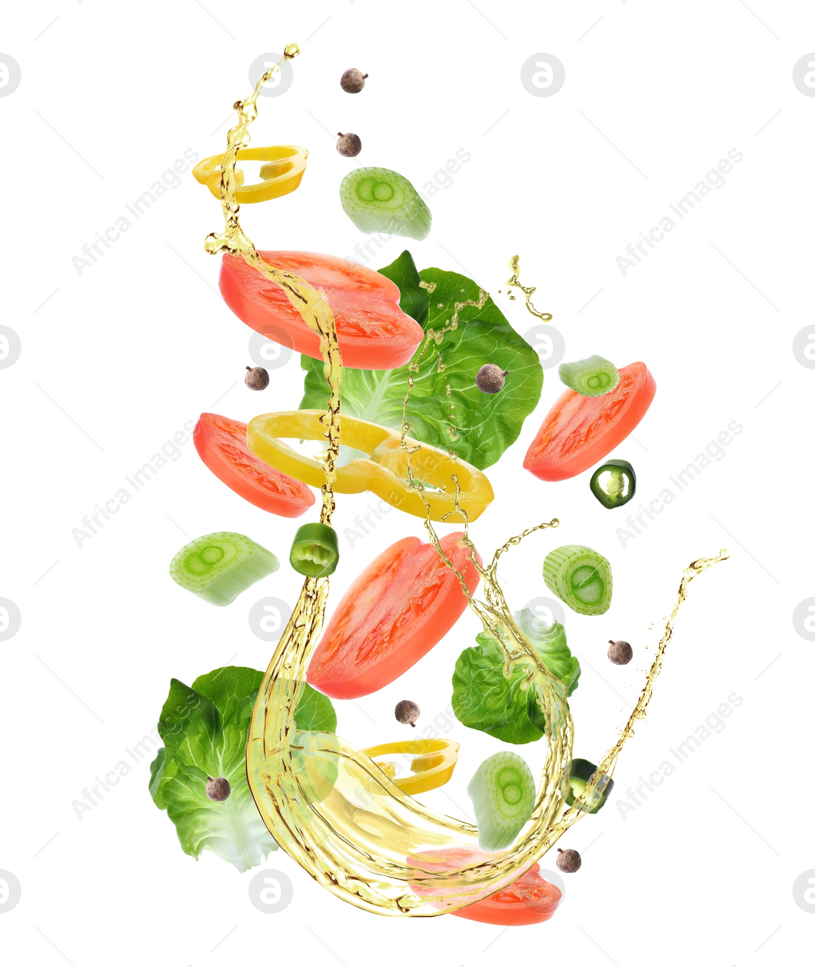 Image of Fresh vegetables and oil for salad in air on white background