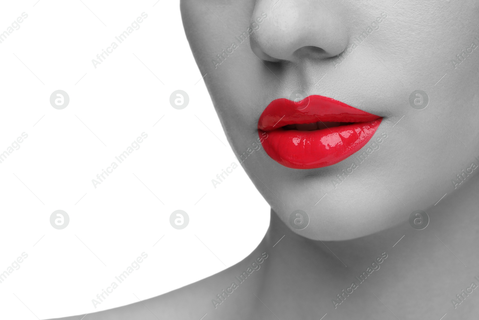 Image of Woman with beautiful red lips on white background, closeup. Black and white effect with color accent