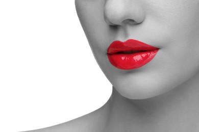 Image of Woman with beautiful red lips on white background, closeup. Black and white effect with color accent