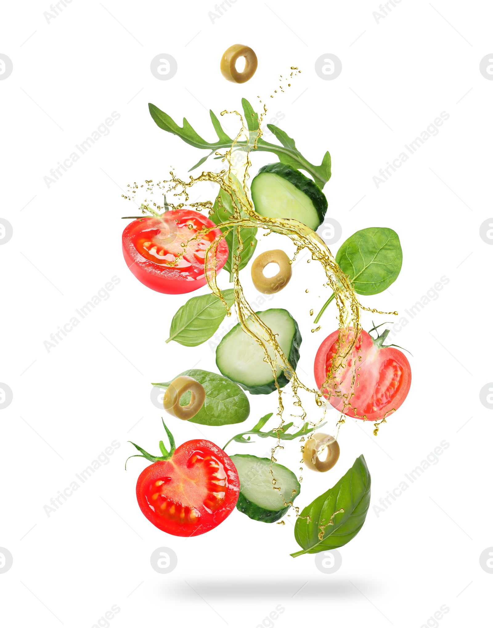 Image of Fresh vegetables and oil for salad in air on white background