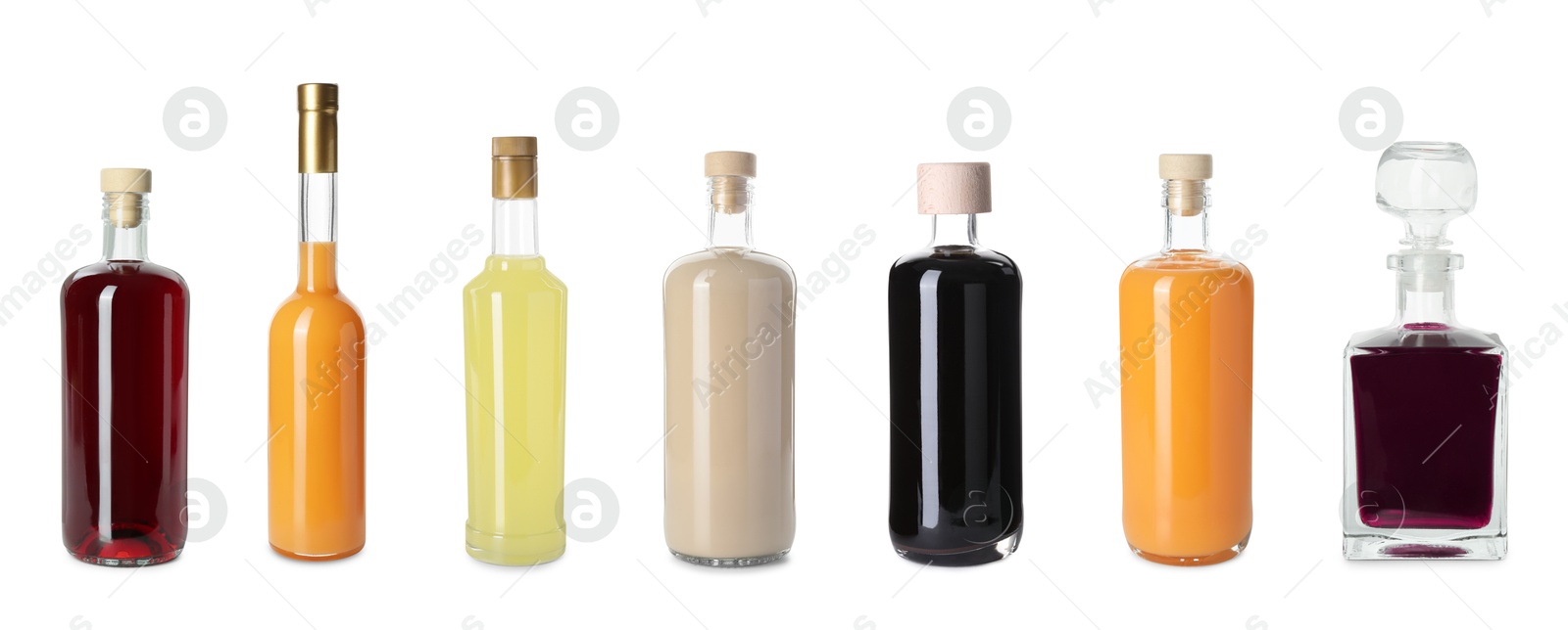 Image of Collection of different tasty liqueurs on white background