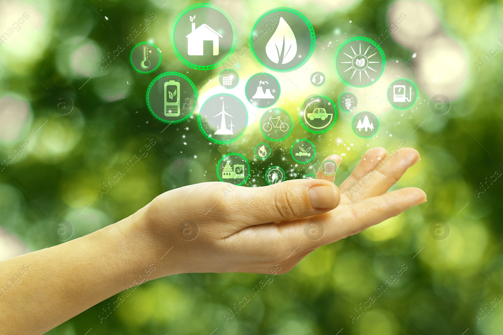 Image of Environmental protection. Woman holding many different icons in nature, closeup