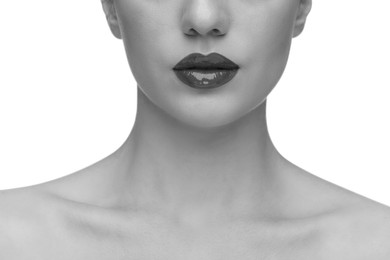 Woman with beautiful lips on white background, closeup. Black and white effect