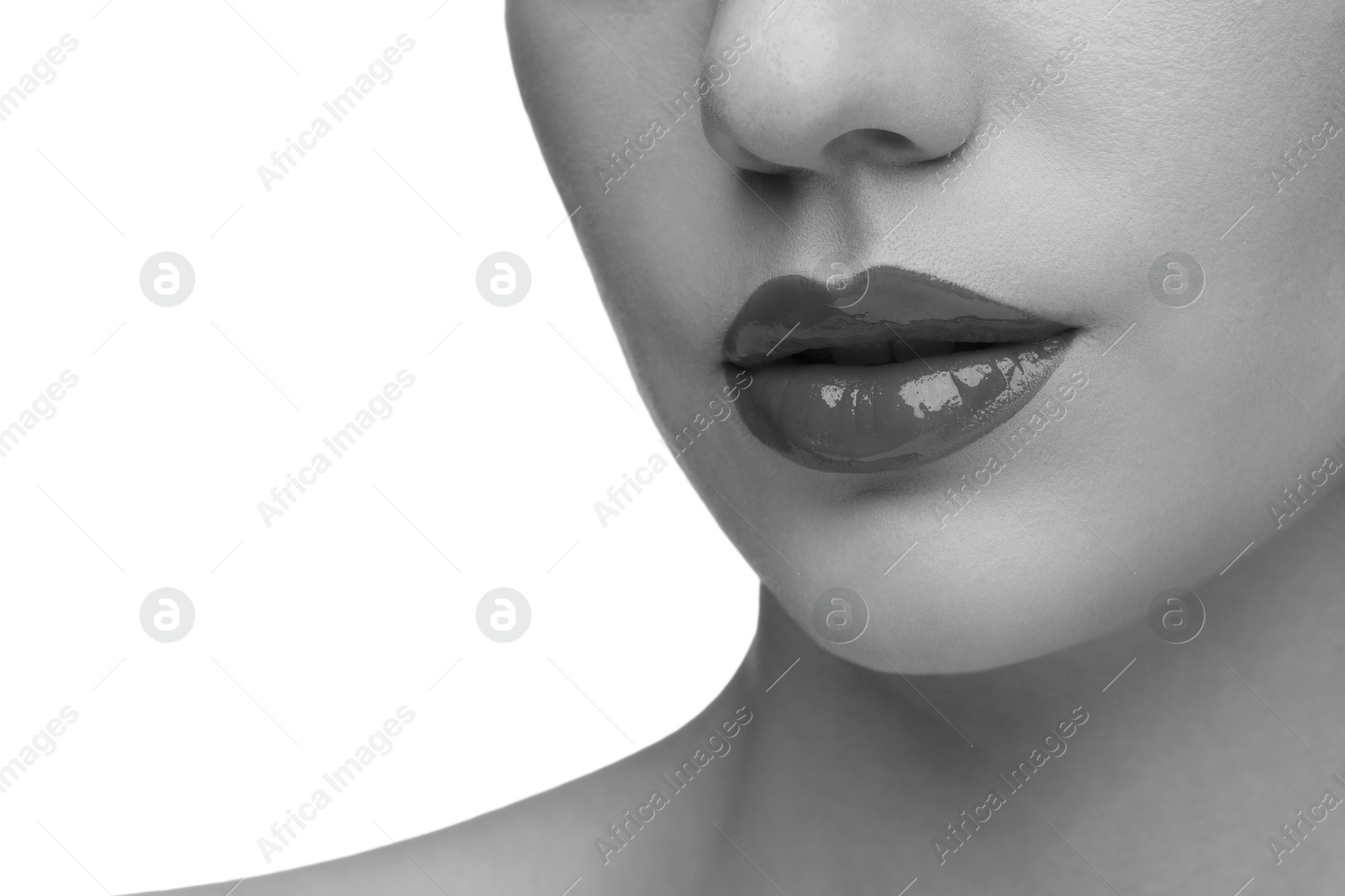 Image of Woman with beautiful lips on white background, closeup. Black and white effect