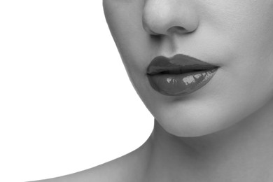 Image of Woman with beautiful lips on white background, closeup. Black and white effect