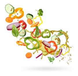 Fresh vegetables and oil for salad in air on white background