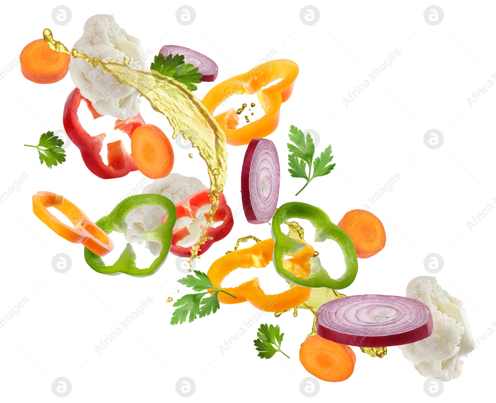 Image of Fresh vegetables and oil for salad in air on white background