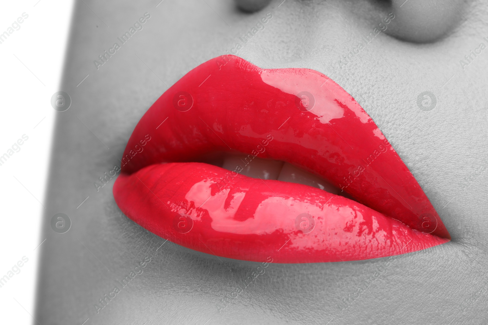 Image of Woman with beautiful red lips, closeup. Black and white effect with color accent