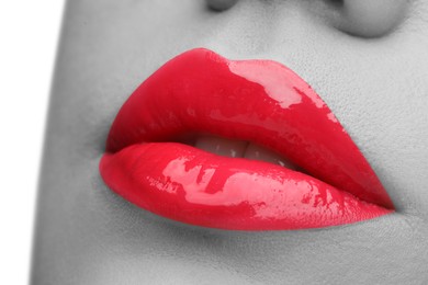 Image of Woman with beautiful red lips, closeup. Black and white effect with color accent