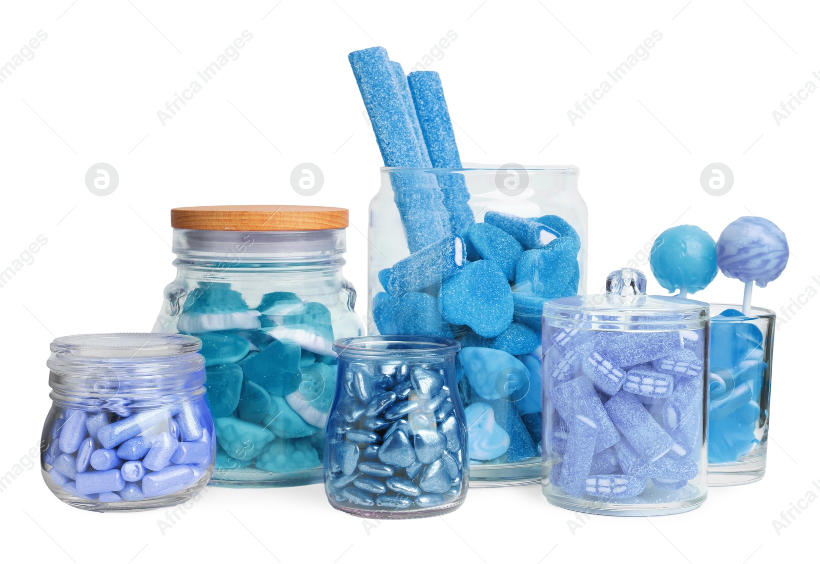 Image of Many blue color candies in glass jars on white background